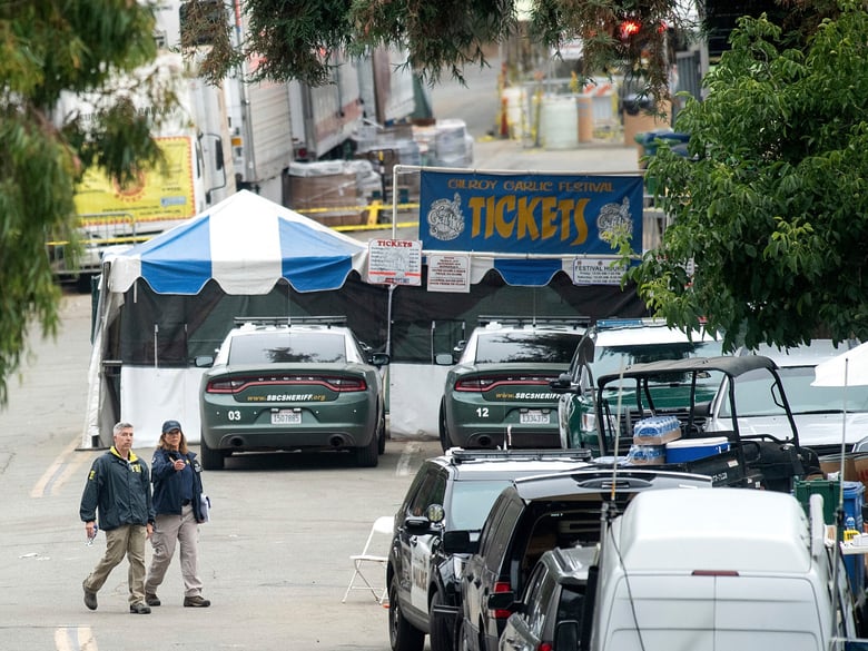 FBI personnel pass a ticket booth at the Gilroy Garlic Festival Monday, July 29, 2019 in Calif., the morning after a gunman killed at least three people, including a 6-year-old boy, and wounding about 15 others.