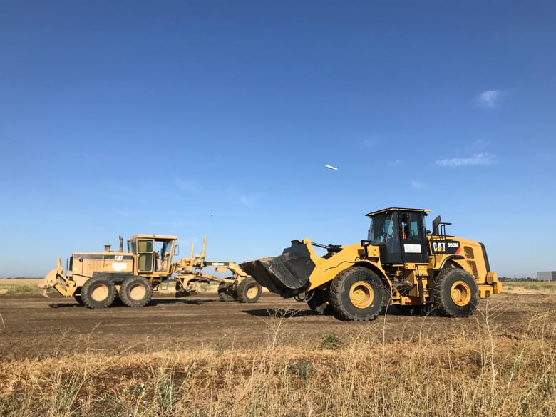 Construction crews work on a project to connect the Metro Air Parkway with Interstate 5.