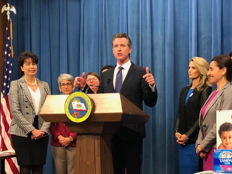 Gov. Gavin Newsom, with members of the legislative Women’s Caucus and First Partner Jennifer Siebel Newsom, outlines his proposed budget’s family priorities, including tax breaks for diapers and expanded family leave.
