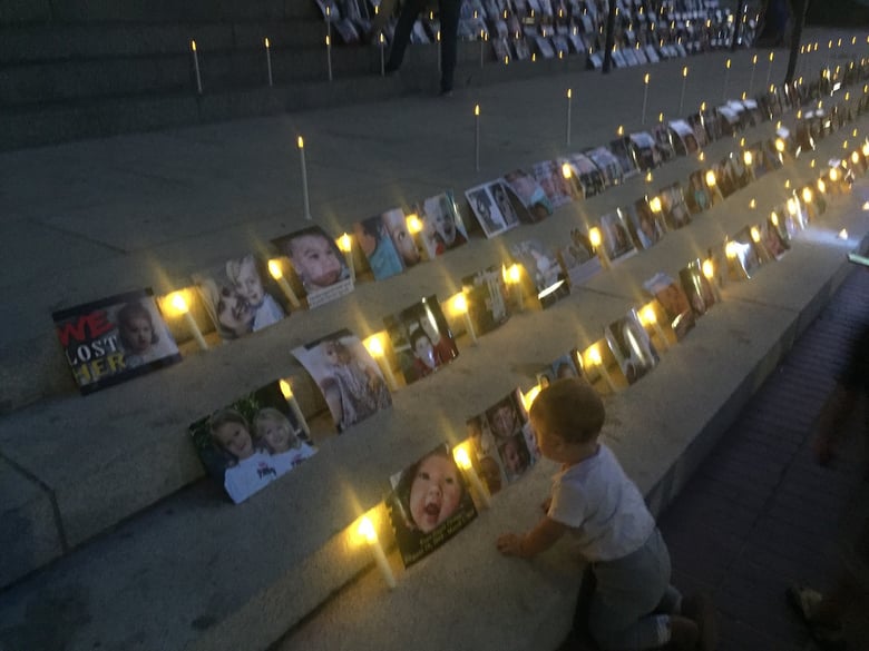Two days after Gov. Gavin Newsom approved a new vaccine law, a small group of protesters held a candlelight vigil at California's Capitol.