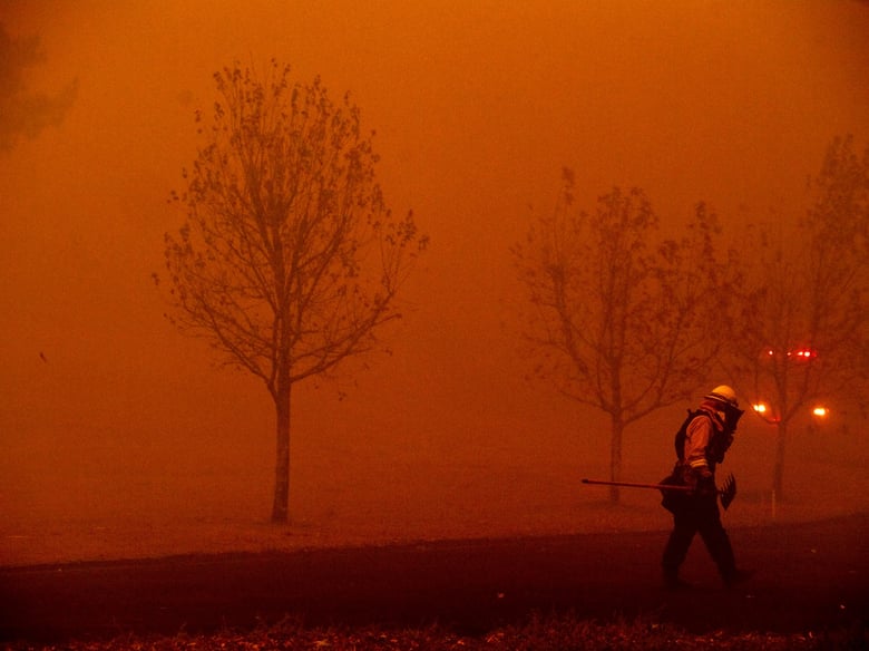 A firefighter battles a wildfire called the Kincade Fire in Healdsburg, Calif., Sunday, Oct. 27, 2019.