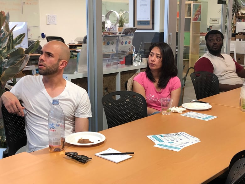 Caner Canik (left), Len Renquillo and Jazzel Woods Sr. listen to a presentation before committing to join a lending circle at Mission Asset Fund in San Francisco on Sept. 17, 2019.
