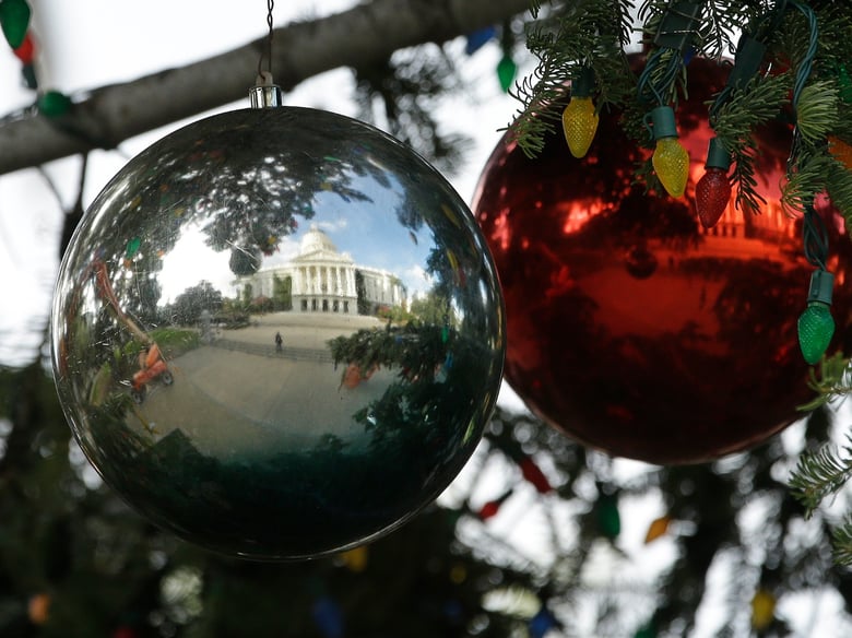 The Capitol Christmas Tree is reflected in one of the hundreds of ornaments decorating the tree Wednesday, Nov. 28, 2018, in Sacramento, Calif.