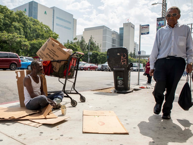 Will, who provided his first name only, panhandles on the sidewalk across the street from LAC+USC Medical Center.