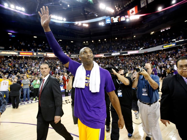In this photo taken Thursday, Jan. 7, 2016, Los Angeles Lakers guard Kobe Bryant waves good bye to the fans after an NBA basketball game against the Sacramento Kings in his last appearance at Sleep Train Arena in Sacramento, Calif.