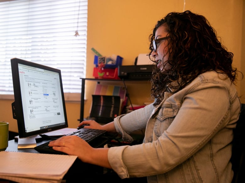 Maria Garcia, at home in Antioch, works her way through a Calbright cyber security course. Her goal is to get a certificate from the first-of-its-kind addition to the community college system, she says.