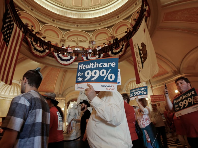 Members of the California Nurses Association and supporters rally in the rotunda at the Capitol calling for a single-payer health plan, Wednesday, June 28, 2017, in Sacramento, Calif.
