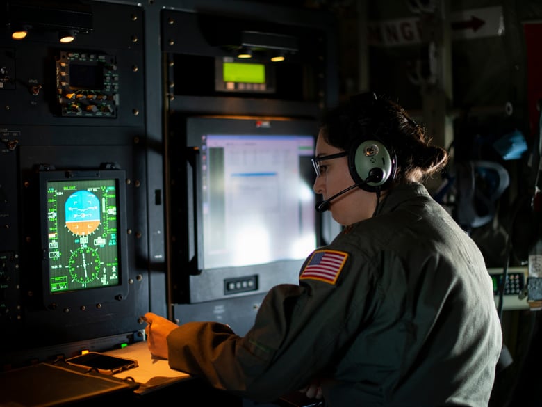Maj. Sonia Walker, 53rd Weather Reconnaissance Squadron aerial reconnaissance weather officer, verifies the dropsonde data is accurate before sending it via satellite to the National Hurricane Center.