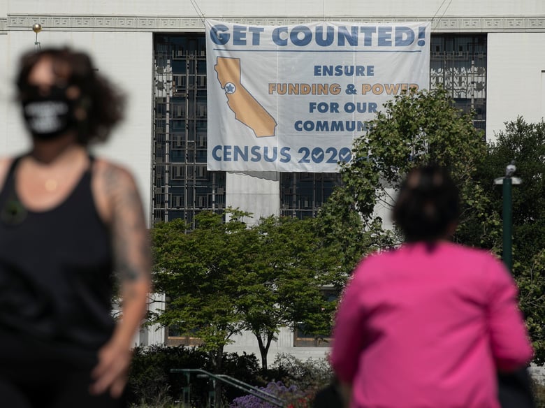 A sign encouraging residents to participate in the 2020 census hangs from the
Alameda County Courthouse in Oakland on April 28, 2020.