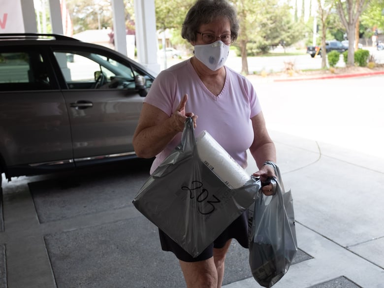 Kathy Midgley brings supplies to her friend staying at a nursing home in Carmichael, Wednesday, April 29, 2020.