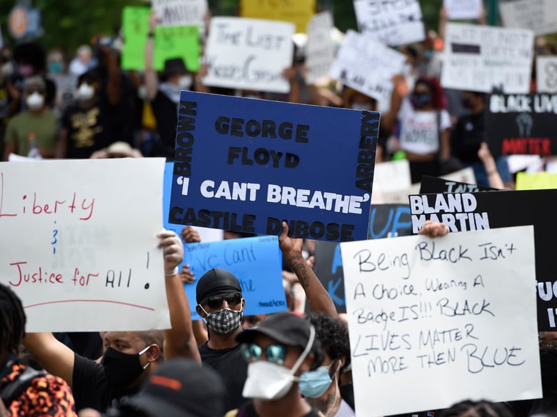 Demonstrators protest in Centennial Olympic Park, Friday, May 29, 2020 in Atlanta. Protests were organized in cities around the United States following the death of George Floyd during an arrest in Minneapolis.