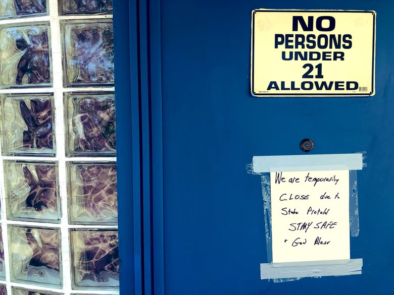 Round Corner Tavern has a sign on their front door that announces that they are closed on June 28, 2020.