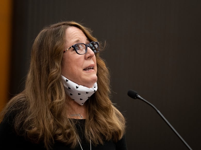 Sandy James looks up from the podium as she makes her statement with Joseph James DeAngelo, known as the Golden State Killer, in the courtroom during the first day of victim impact statements Tuesday, Aug. 18, 2020, in Sacramento, Calif.