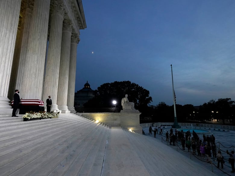 The flag-draped casket of Justice Ruth Bader Ginsburg lies in repose under the Portico at the top of the front steps of the U.S. Supreme Court building on Thursday, Sept. 24 2020, in Washington.