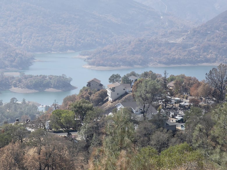 Homes destroyed by the LNU Lighting Complex Fire are interspersed with untouched homes above Lake Berryessa, a resort area and water supply reservoir, on Sept. 21, 2020.