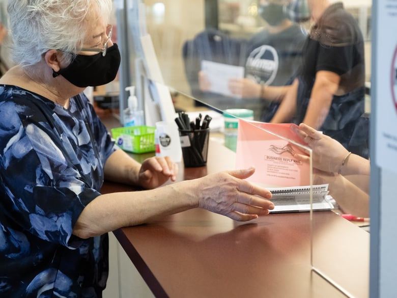 Rachel Lyman picks up her mail-in ballot at the Sacramento County Elections Office on Monday, Oct 5, 2020.
