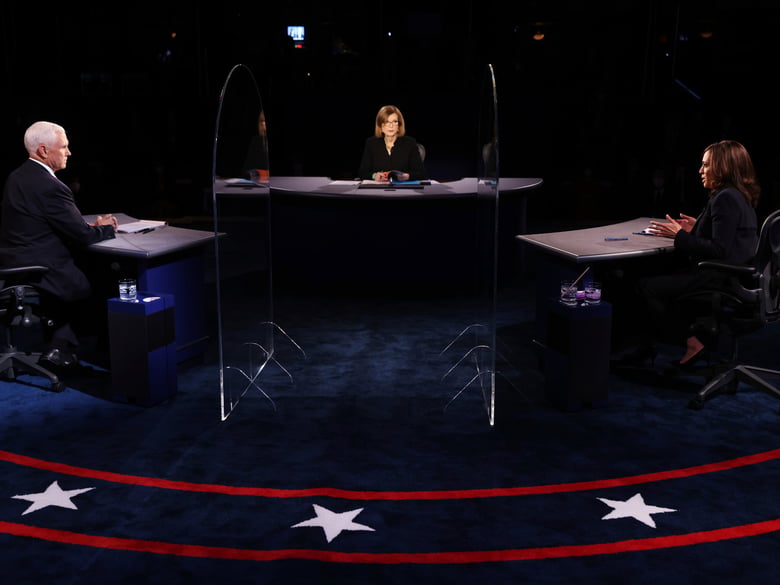Vice President Mike Pence listens as Democratic vice presidential candidate Sen. Kamala Harris, D-Calif., speaks during the vice presidential debate Wednesday, Oct. 7, 2020, at Kingsbury Hall on the campus of the University of Utah in Salt Lake City.