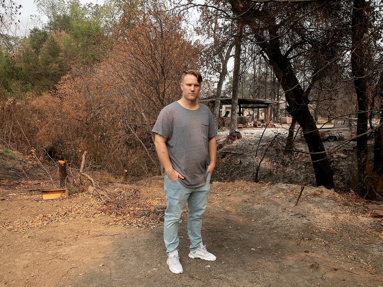 Taylor Craig stands on the edge of his family’s property outside of Vacaville on Oct. 2, 2020. Charred trees on the adjoining property were caused by the LNU Lightning Complex Fire in August.