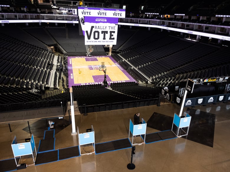 A voter uses a touchscreen at the Golden1 Center in Sacramento, Saturday, Oct. 24, 2020.