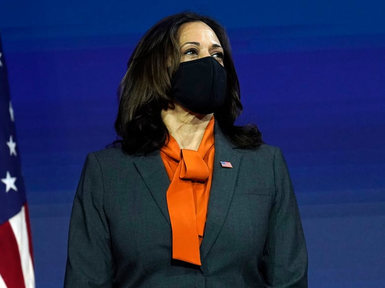 Vice President-elect Kamala Harris listens as President-elect Joe Biden speaks Monday, Nov. 9, 2020, at The Queen theater in Wilmington, Del.