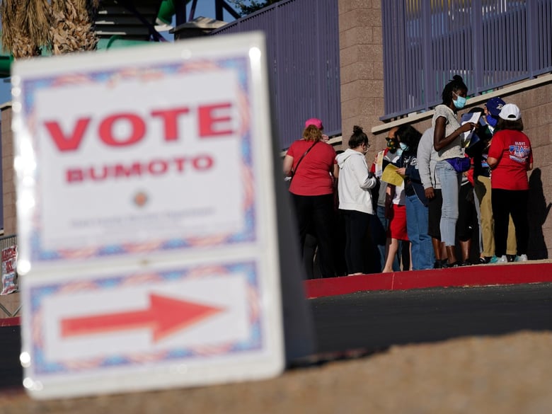 People wait in line to vote at a polling place on Election Day, Tuesday, Nov. 3, 2020, in Las Vegas.
