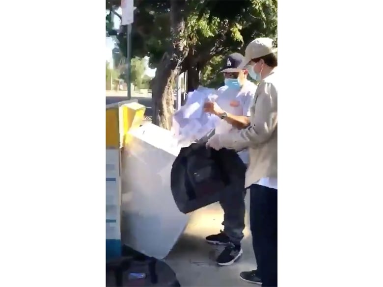A screenshot of a TikTok video reshared by President Donald Trump showing election workers in Los Angeles County legally collecting ballots from a drop box.