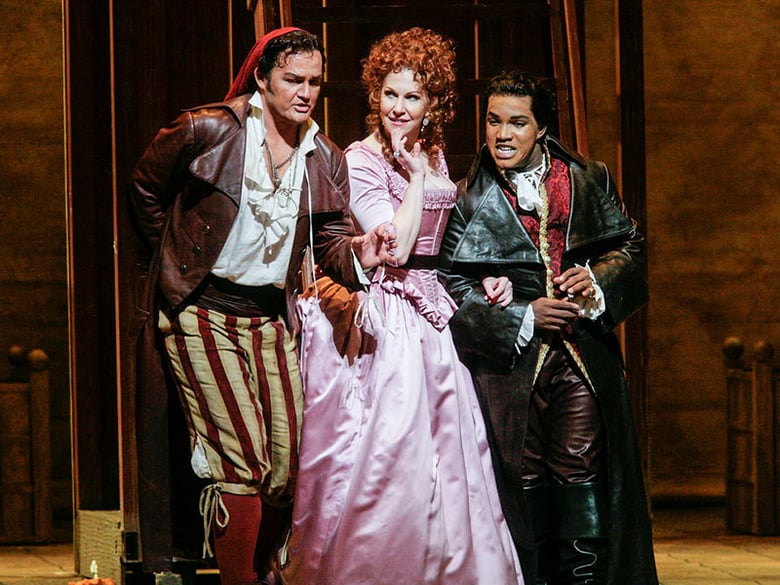 Russell Braun as Figaro, Joyce DiDonato as Rosina, and Lawrence Brownlee as Count Almaviva in Rossini's "Il Barbiere di Siviglia." Photo: Ken Howard/Met Opera