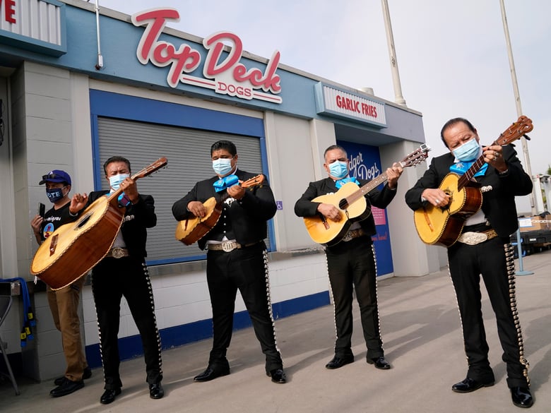 The Los Pasajeros mariachi band plays for voters at a polling place at Dodger Stadium on Election Day, Tuesday, Nov. 3, 2020, in Los Angeles.