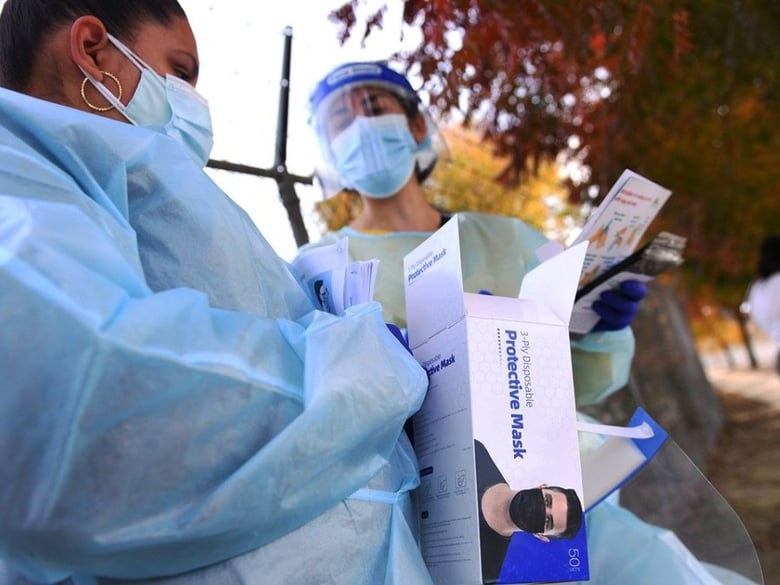 Health care workers wait to offer COVID-19 testing at Cristo Rey Church Friday afternoon, Nov. 20, 2020 in Malaga, south of Fresno.