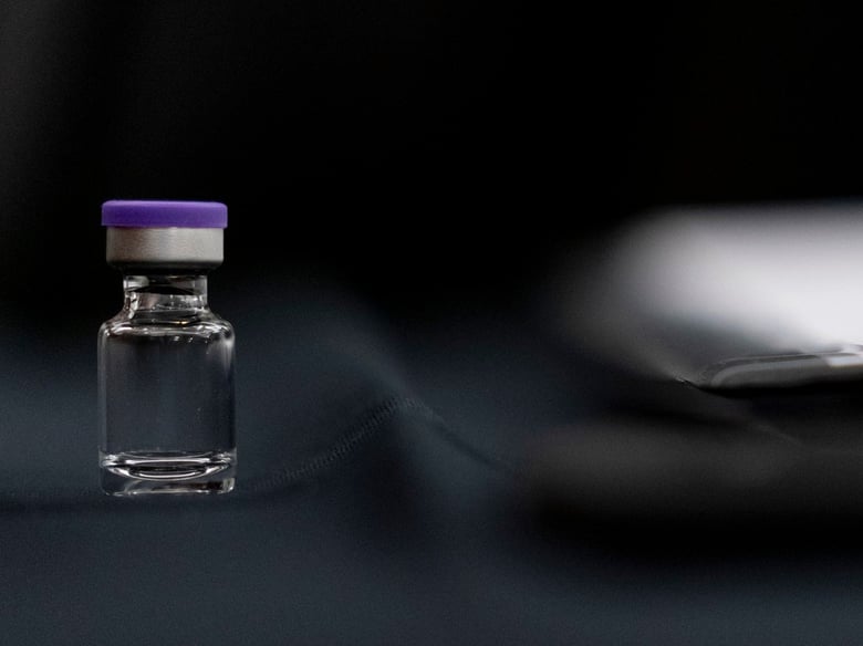 An example of a vial that will carry the COVID-19 vaccine produced by Pfizer and BioNTech sits on display during a Senate subcommittee hearing Thursday.
