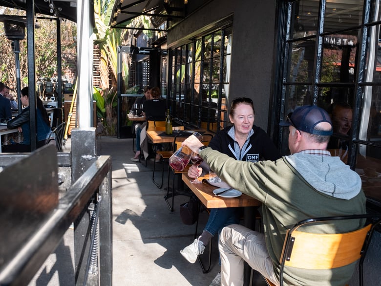Cara and Michael Busch have a meal and wine at Revolution Winery & Kitchen Wednesday, Jan 13, 2021.