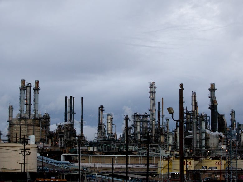 California's cap and trade program offers oil refineries, like this Valero plant in Wilmington, the option to buy credits to offset carbon emissions.