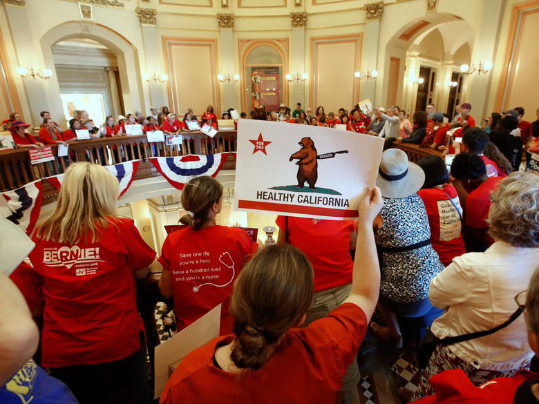 Members of the California Nurses Association and supporters rally at the State Capitol calling for a single-payer health plan on June 28, 2017, in Sacramento.