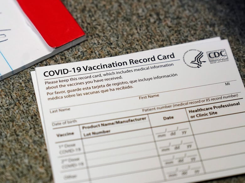 In this Dec. 24, 2020, file photo, a COVID-19 vaccination record card is shown at Seton Medical Center in Daly City, Calif.