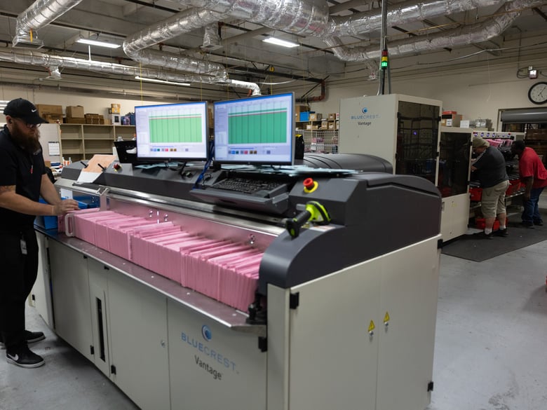 Workers use a machine to sort ballots at the Sacramento County Registrar's office, Tuesday, Nov. 8, 2022.