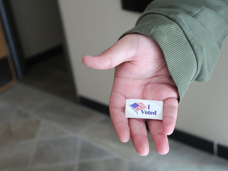 Elijah, a student, shows off his “I Voted” sticker after submitting his ballot at the Sacramento State campus voting center on Tuesday, March 5, 2024. Elijah, a student, shows off his “I Voted” sticker after submitting his ballot at the Sacramento State campus voting center on Tuesday, March 5, 2024.