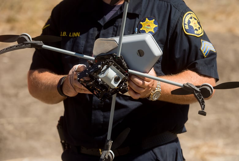 Sgt. Jim Linn retrieves the Alameda County Sheriff's Office drone while demonstrating a search and rescue operation on Friday, Aug. 14, 2015, in Dublin, Calif. Sgt. Jim Linn retrieves the Alameda County Sheriff's Office drone while demonstrating a search and rescue operation on Friday, Aug. 14, 2015, in Dublin, Calif.