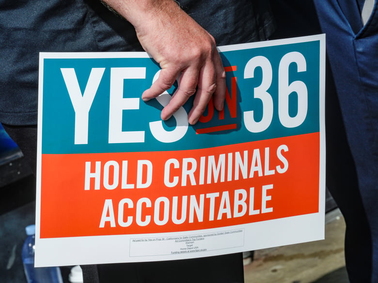 7-Eleven leadership and franchisees support the Yes on Prop 36 campaign outside the 7-Eleven that was robbed by about 50 juveniles in late September in Los Angeles during a news conference, Thursday, Oct. 10, 2024.