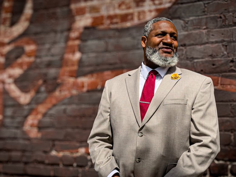 Julius Austin stands outside Underground Books in Oak Park, a key neighborhood within Sacramento’s 22-square-mile Promise Zone.