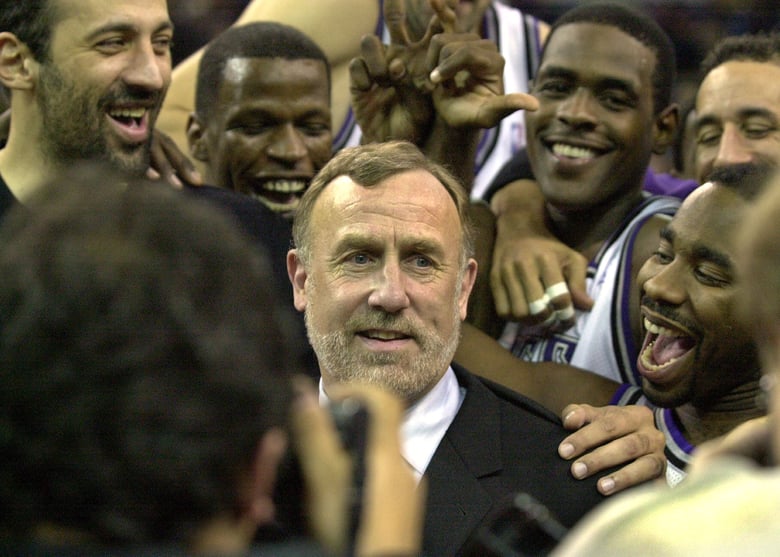 Sacramento Kings coach Rick Adelman, center, is mobbed by his players at Arco Arena in Sacramento, Calif., after the Kings defeated the Orlando Magic 112 -100, marking Adelman's 500th career coaching victory, Tuesday, Dec. 11, 2001. AP file photo