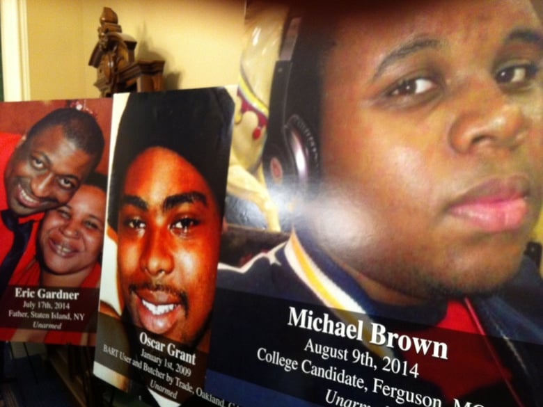Pictures of black men killed by police, displayed at a news conference for the Legislative Black Caucus.
