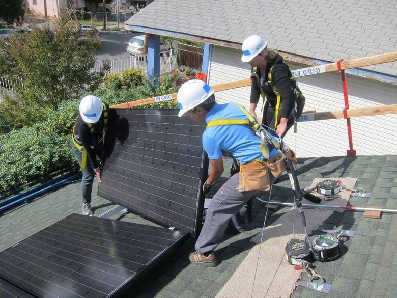 Rooftop solar is installed in a Sacramento neighborhood.