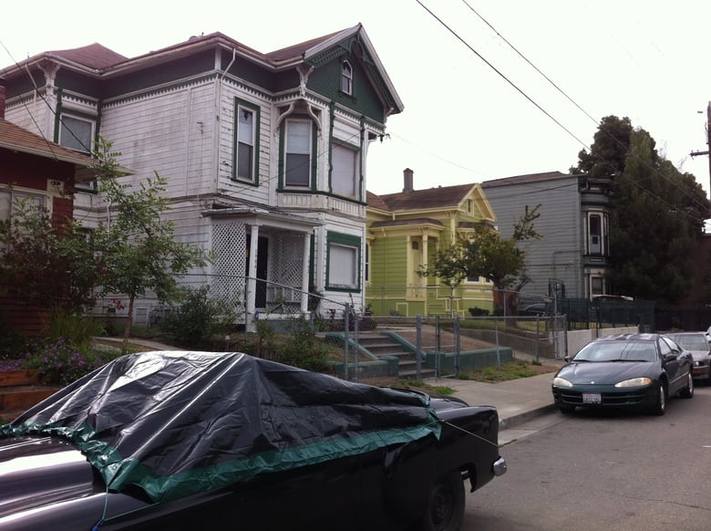 A house on this street in a historically struggling neighborhood in West Oakland sold for nearly $425,000 in Fall 2014, epitomizing the squeeze on middle-class families in California's housing market.