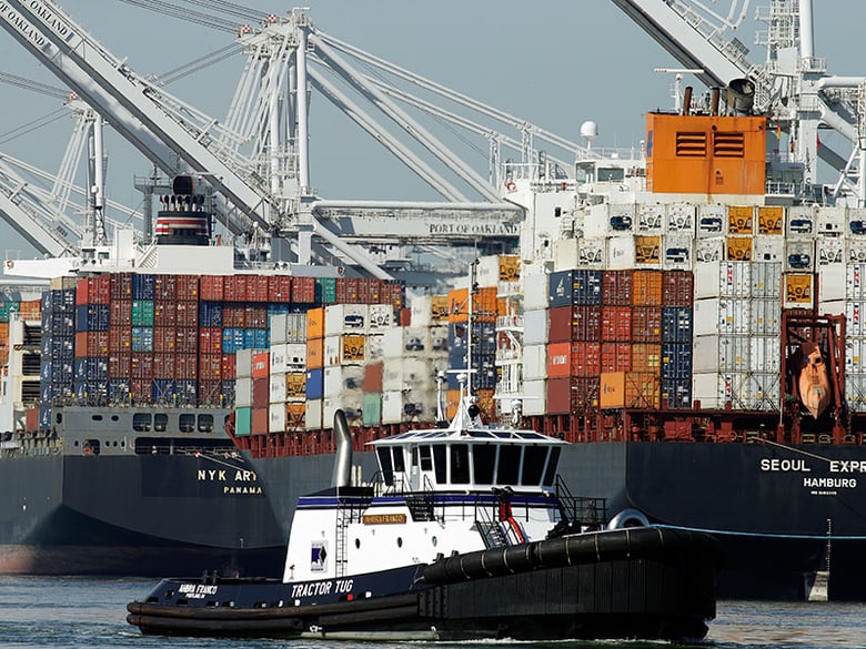 Container ships wait to be unloaded at the Port of Oakland, Thursday, Feb. 12, 2015, in Oakland, Calif.