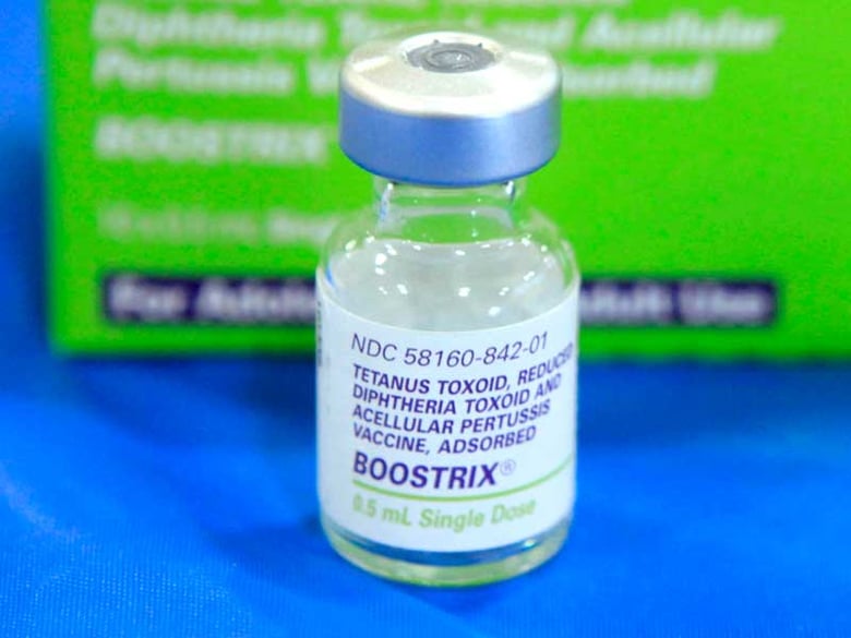 This Sept. 19, 2011 file photo shows an empty bottle of Tetanus, Diphthera and Pertussis, (whooping cough) vaccine at Inderkum High School in Sacramento, Calif.