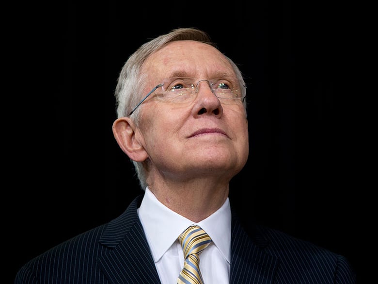 Senate Majority Leader Harry Reid of Nev., looks to President Barack Obama as he speaks about immigration at Del Sol High School, in Las Vegas, Friday, Nov. 21, 2014.