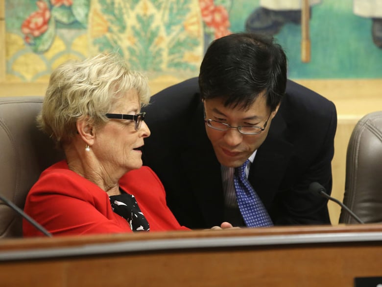 Sen. Richard Pan, D-Sacramento, talks with Sen. Sharon Runner, R-Lancaster, after she voted against his measure requiring California schoolchildren to get vaccinated, at the Capitol in Sacramento, Calif. Wednesday, April 22, 2015.