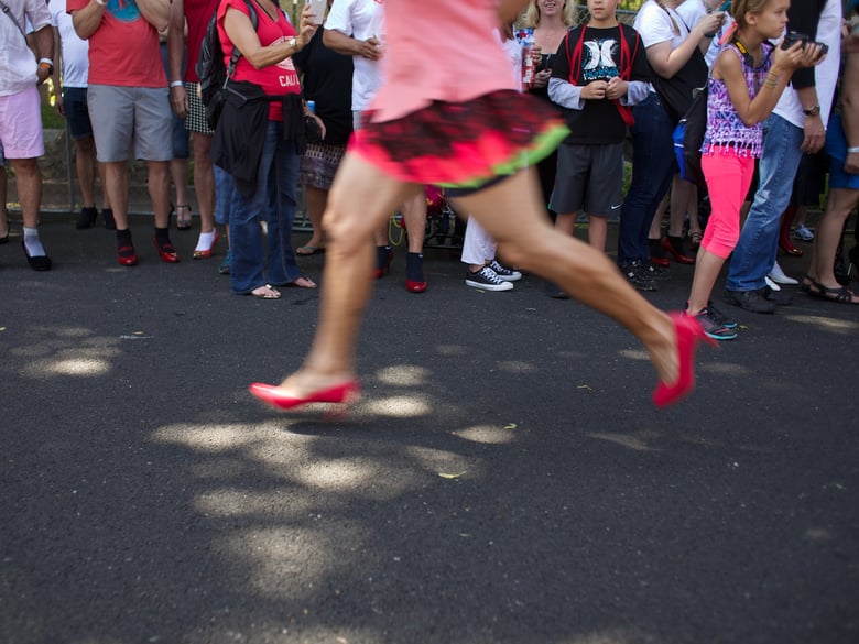 Participants run a mile sprint at WEAVE's "Walk a Mile in her Shoes." This year's event was the 5th to be held in Sacramento.