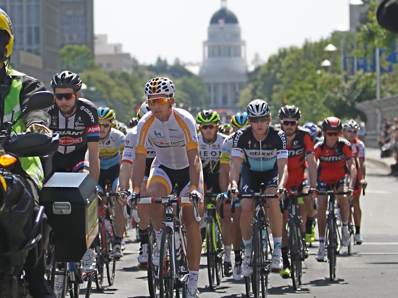 Riders race down Capital Mall during the first stage of the Amgen Tour of California cycling race in Sacramento, Calif., Sunday, May 10, 2015.