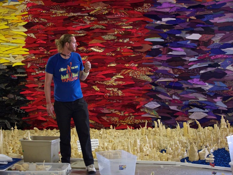 Tapigami Founder Danny Scheible surveys his installation at Maker Faire. 